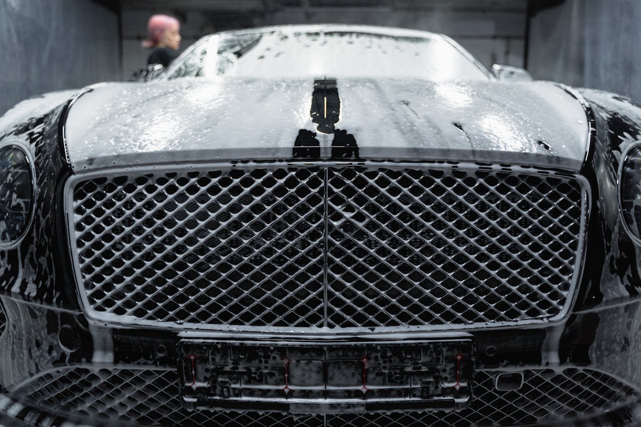 A Black Car Covered with Soap